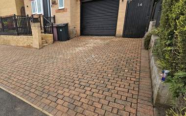 Block paving driveway cleaned and re sanded, colour fully restored
