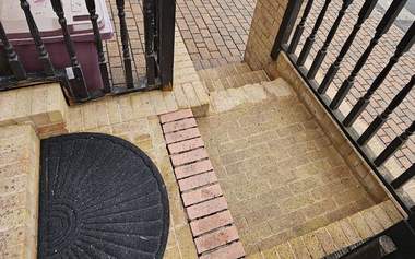 Brick paved steps and porch cleaned back to their original colour