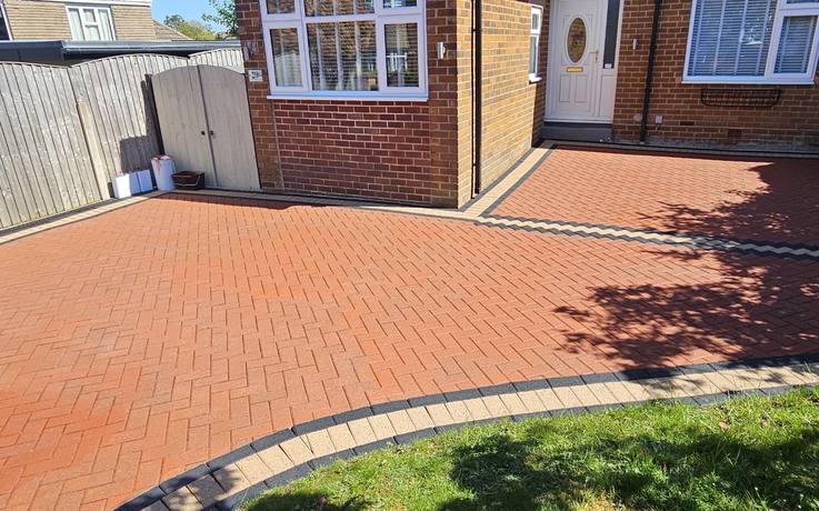 Bungalow driveway pressure washed back to a deep red colour