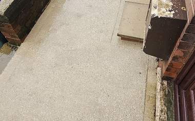 A concrete patio cleaned back to bare concrete