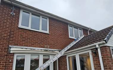 Ladder and pole access set up for gutter work