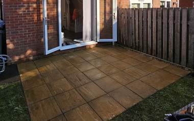 Indian sandstone patio cleaned back to a warm buff colour
